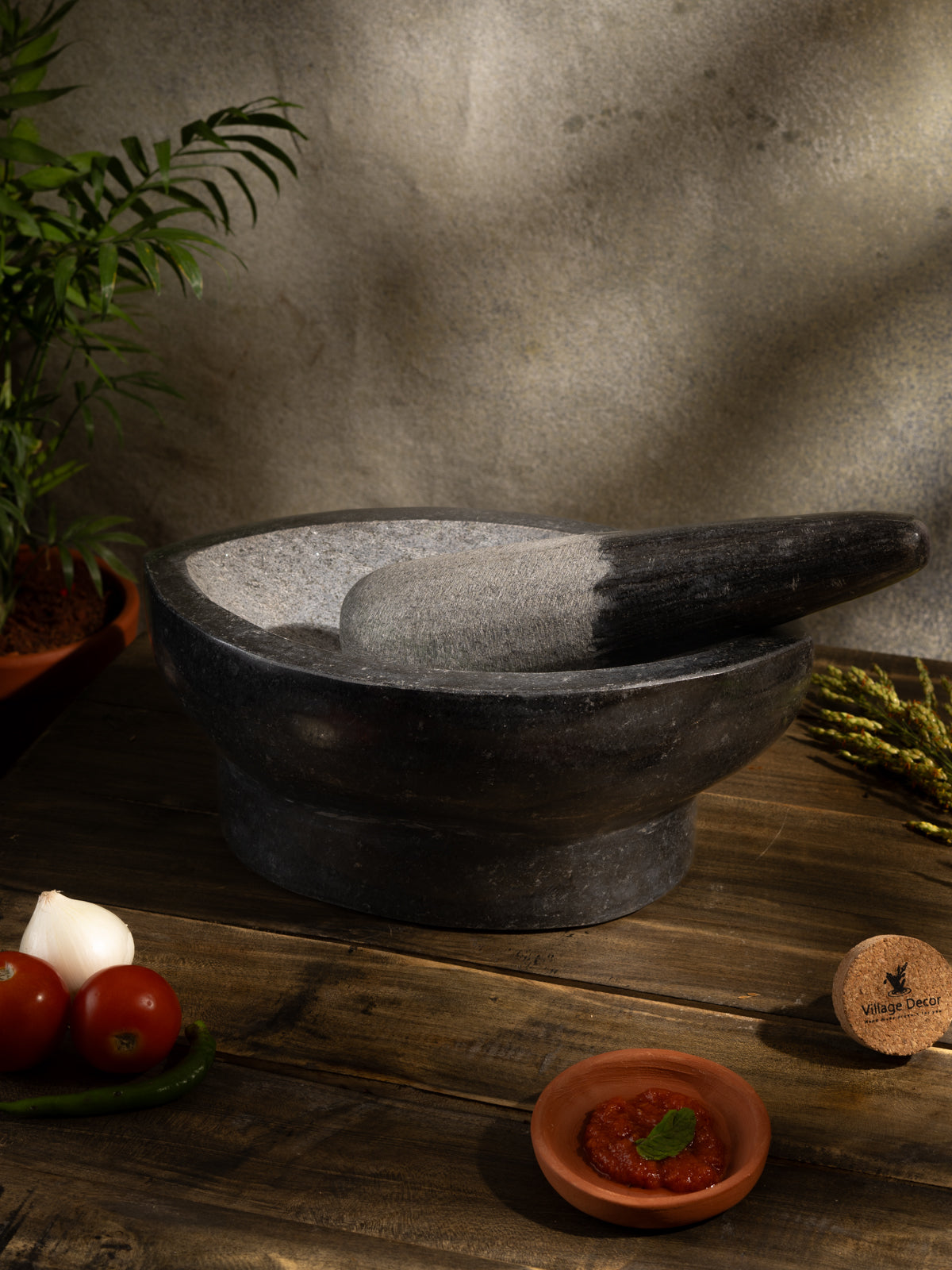 Traditional Handmade Kharal placed on table surrounded by fresh ingredients.